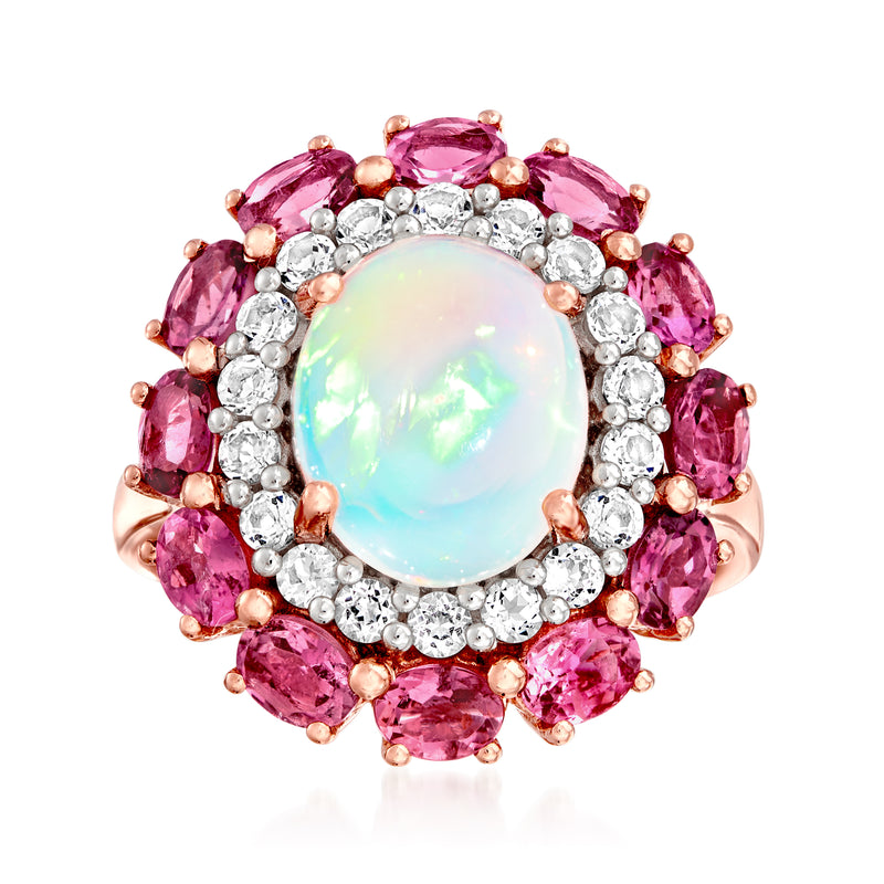 Oval opal center ring with pink gemstone halo and white stone border on rose-gold band