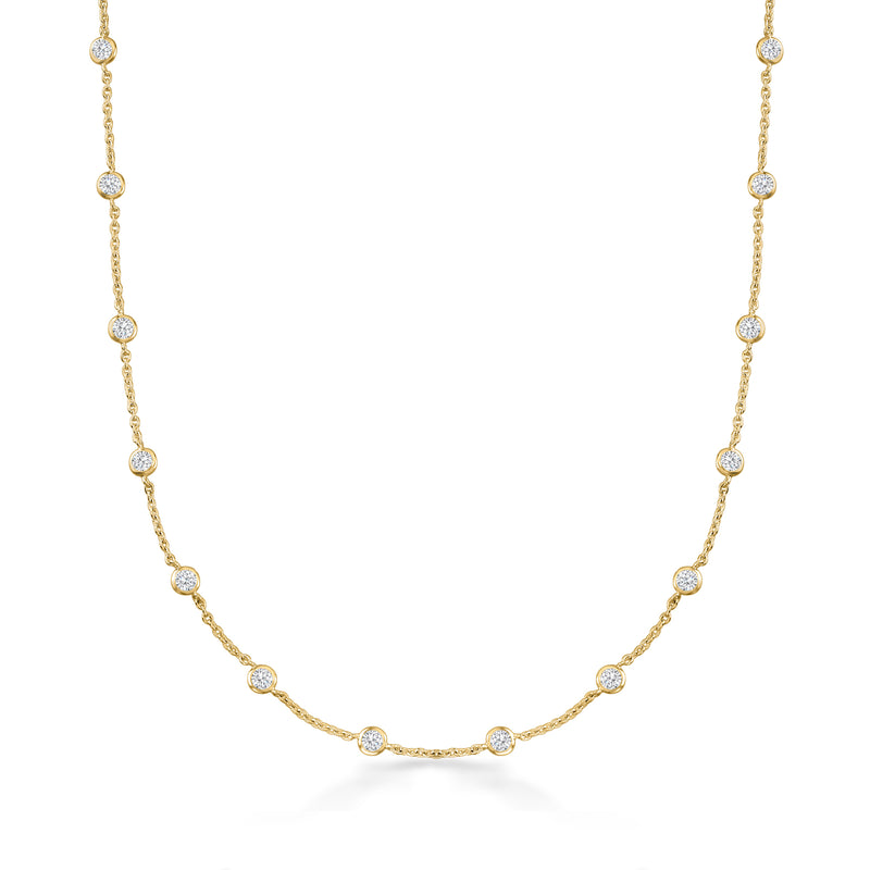Gold-tone CZ station necklace with small round stones along a slim chain.