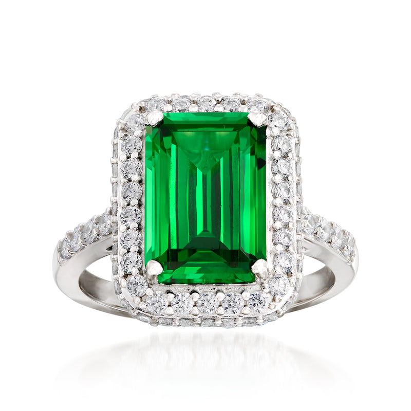 Sterling silver emerald-cut CZ ring with green center stone and clear halo