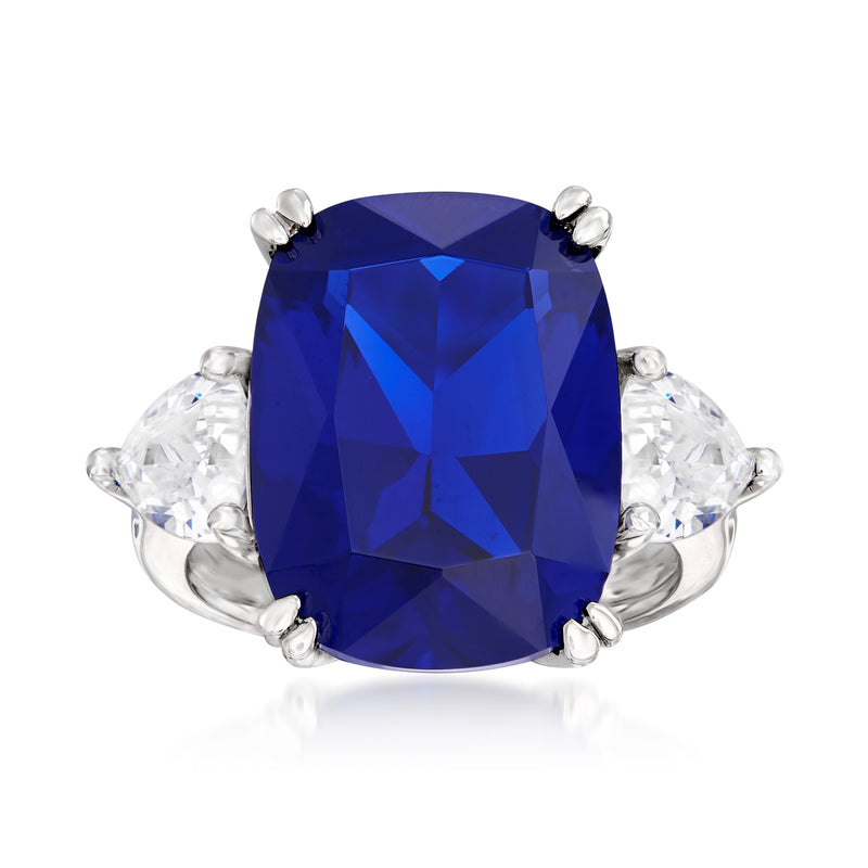 Sterling silver ring with large cushion-cut deep blue stone and clear side stones