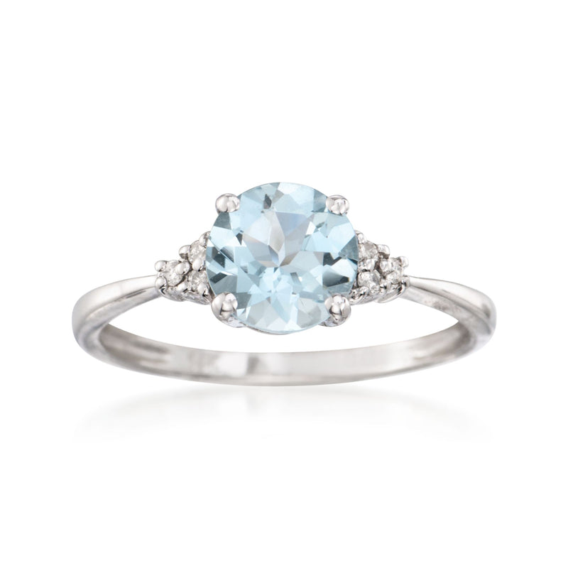 Aquamarine and diamond ring in 14kt white gold, oval center with side stones