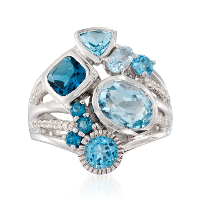 Sterling silver blue topaz ring with white topaz accents; oval center and round side stones