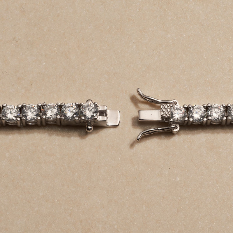Sterling silver tennis bracelet clasp detail with row of round CZ stones