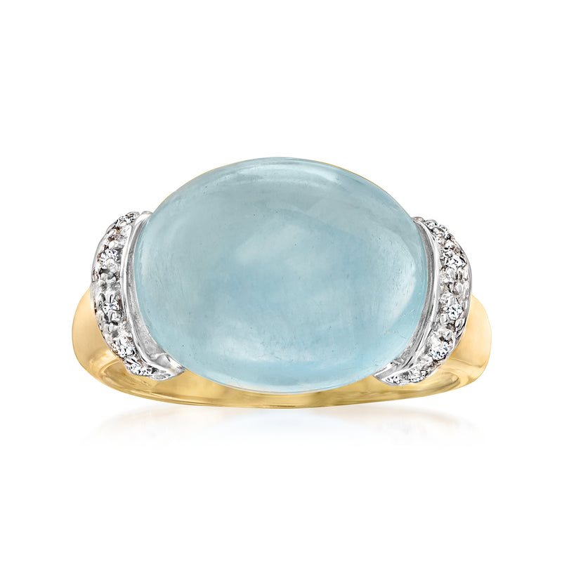Oval aquamarine gemstone ring in 14kt yellow gold with diamond halo and side accents