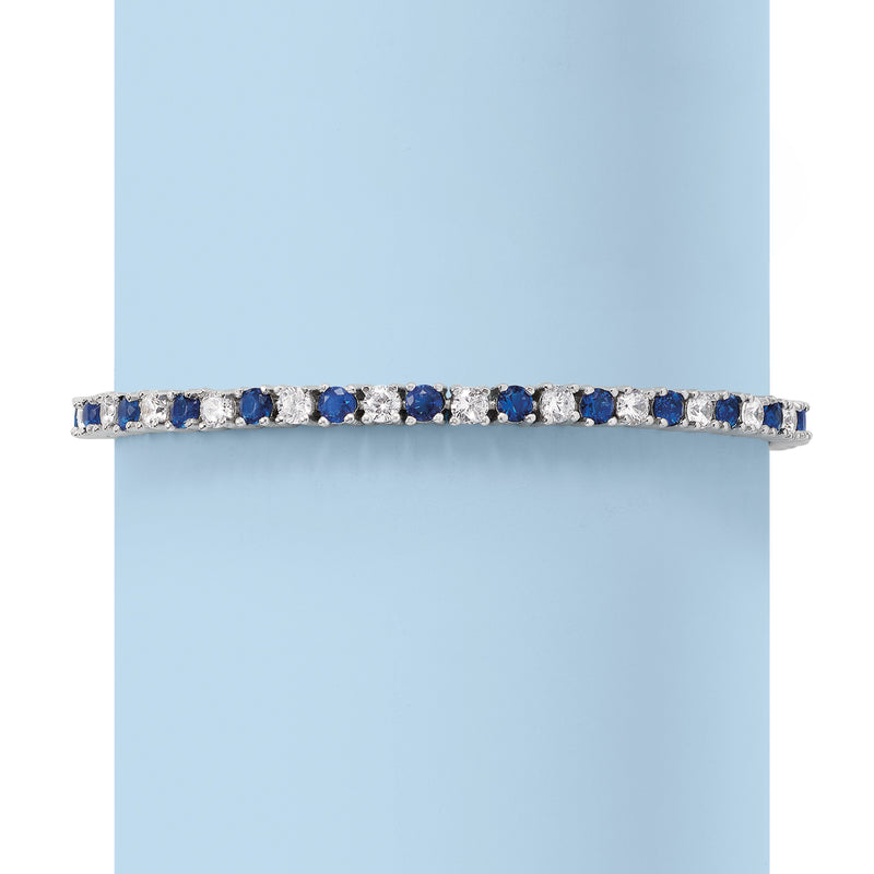 Sterling silver tennis bracelet side view with blue simulated sapphire and clear stones