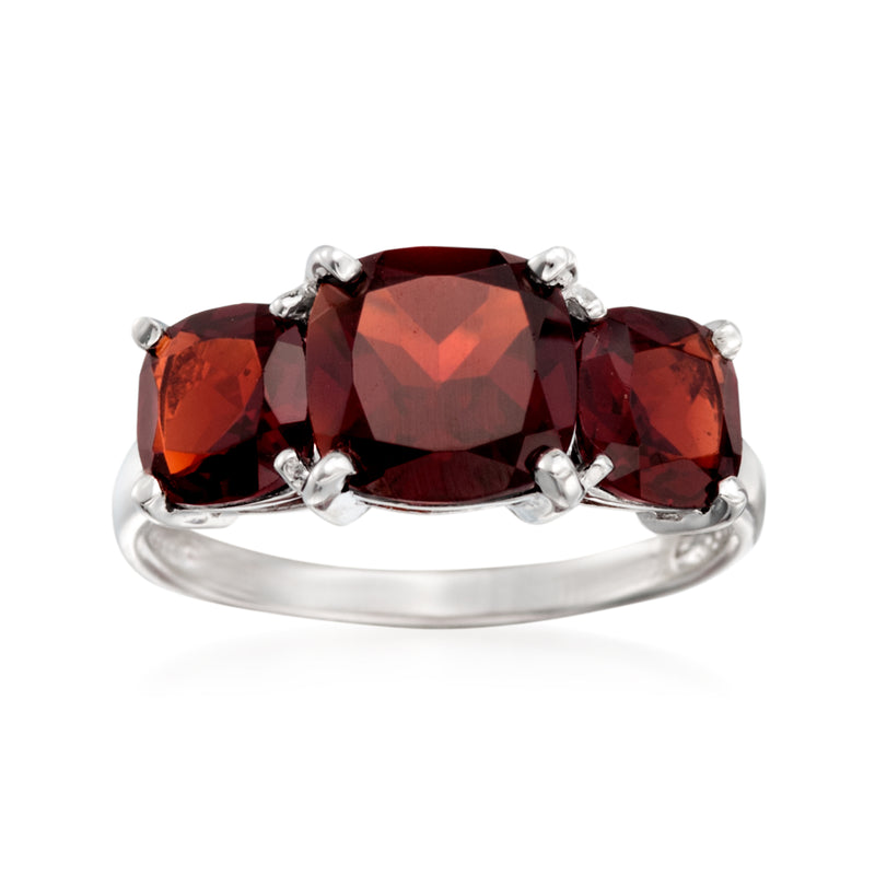 Sterling silver garnet three-stone ring with oval red stones in prong settings