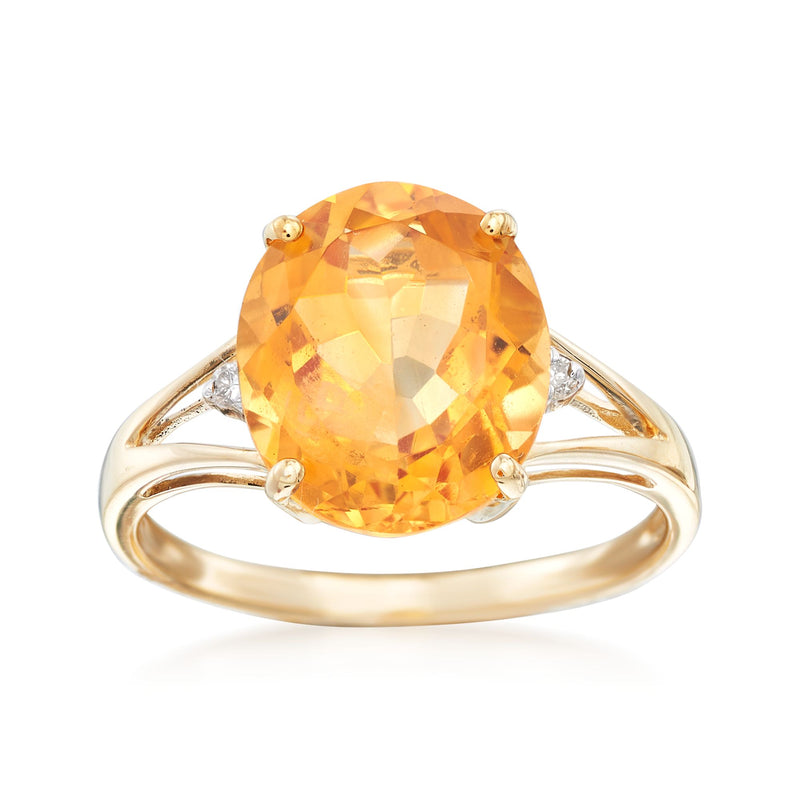 14kt yellow gold citrine ring with oval orange center and diamond-accent shoulders