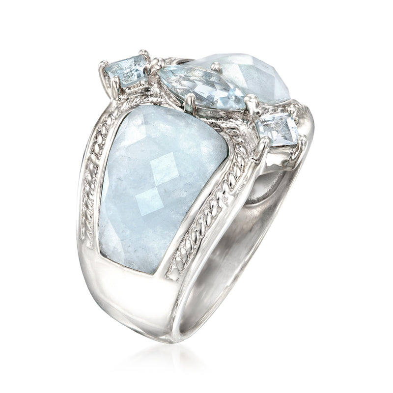 Sterling silver ring with large faceted light-blue aquamarine center and side stones
