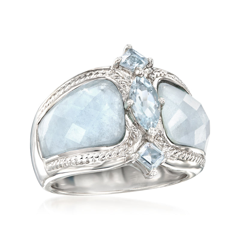 Sterling silver ring with two light-blue aquamarine side stones and central oval stone