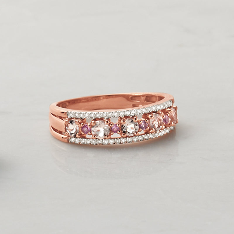 Rose gold band ring with oval pink center stones and diamond halo rows