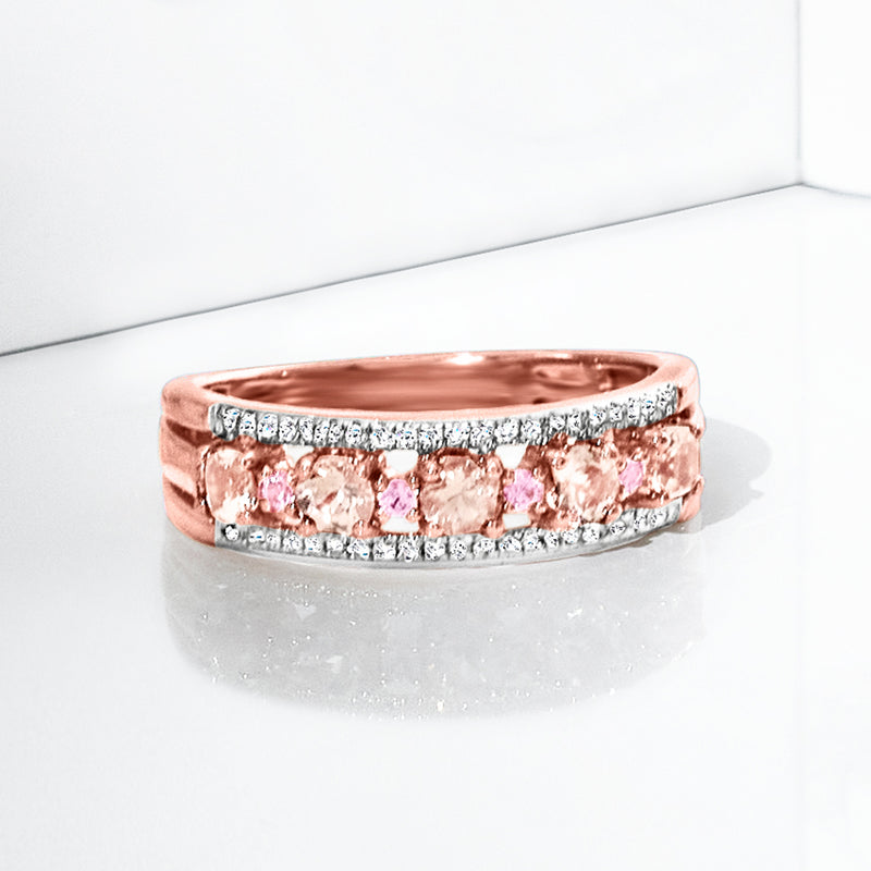 Rose gold ring with stacked oval pink gemstones and diamond border