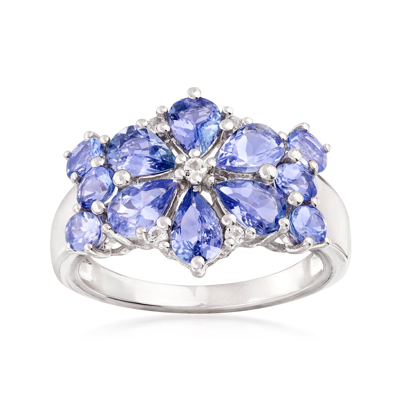 Sterling silver floral ring with blue oval gemstones and small clear accents