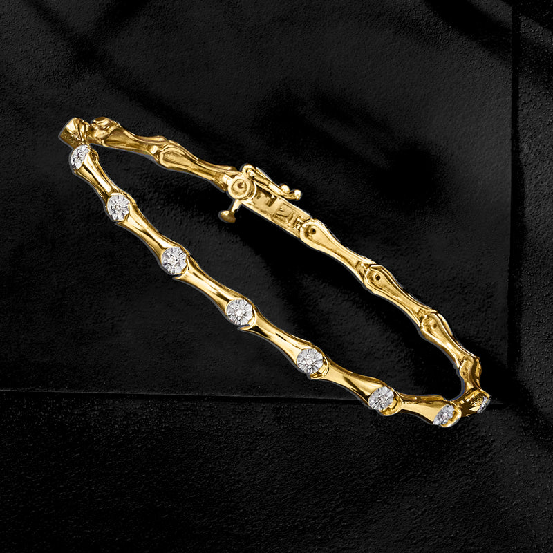 Gold over sterling bracelet with row of round diamond stations and oval links