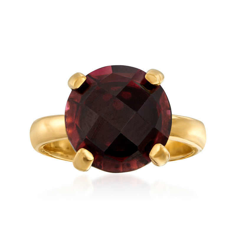 Gold over sterling ring with round faceted dark red garnet and four raised prongs