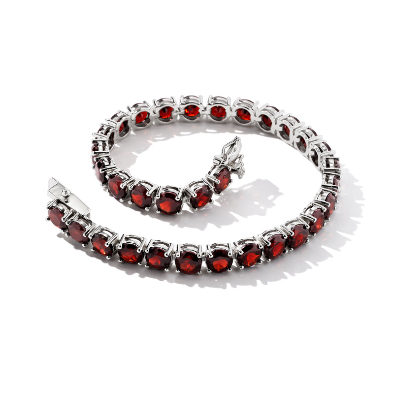 Sterling silver tennis bracelet with round red garnet stones, open view