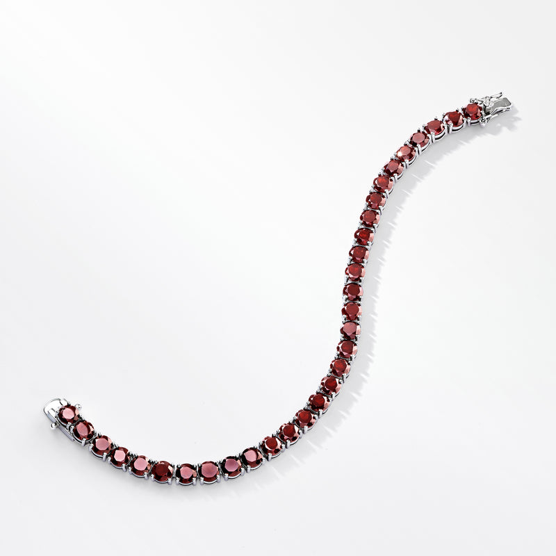 Red garnet tennis bracelet in sterling silver, curved side view