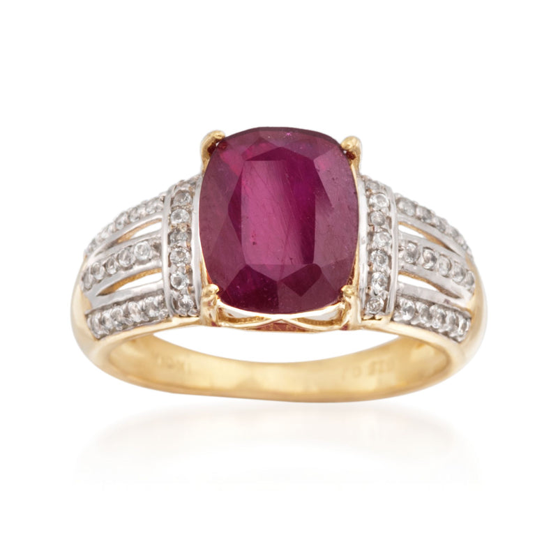 14kt gold over sterling ring with oval ruby center and white topaz side stones