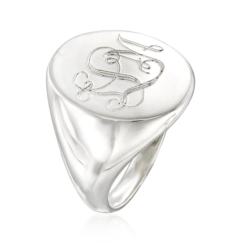 Silver signet ring with engraved cursive initial and decorative flourishes
