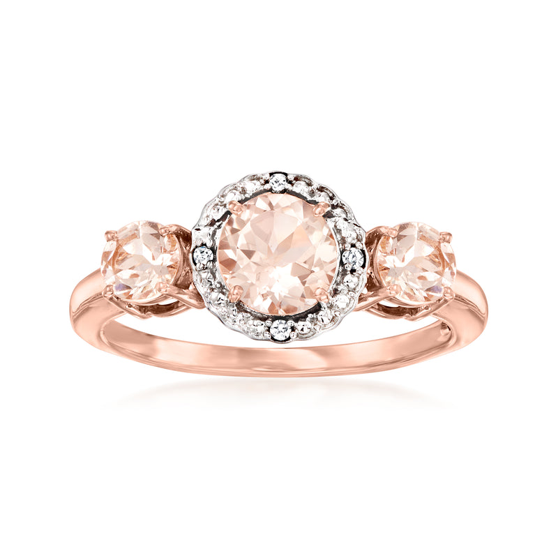 Two-tone gold morganite and diamond halo ring with three peach oval stones