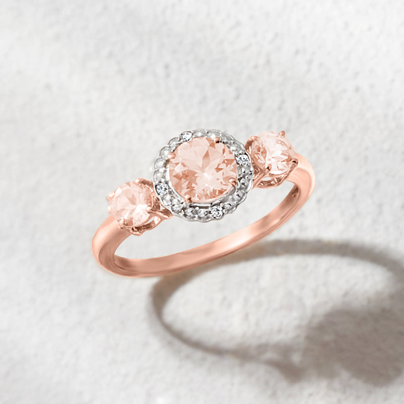 Three-stone two-tone morganite ring with diamond halo and polished rose gold band