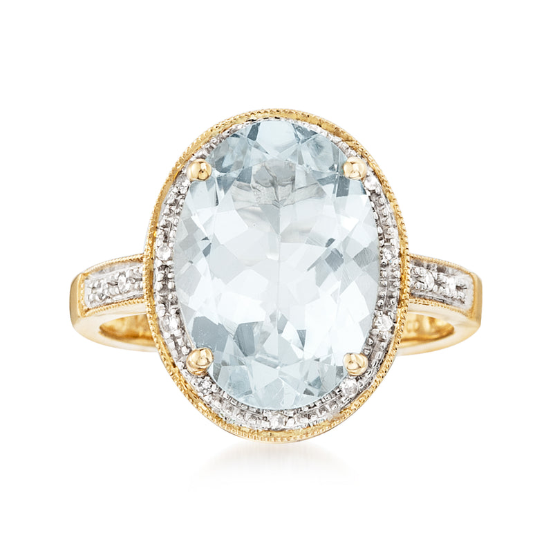 Oval aquamarine ring with diamond halo and accents, 14kt yellow gold