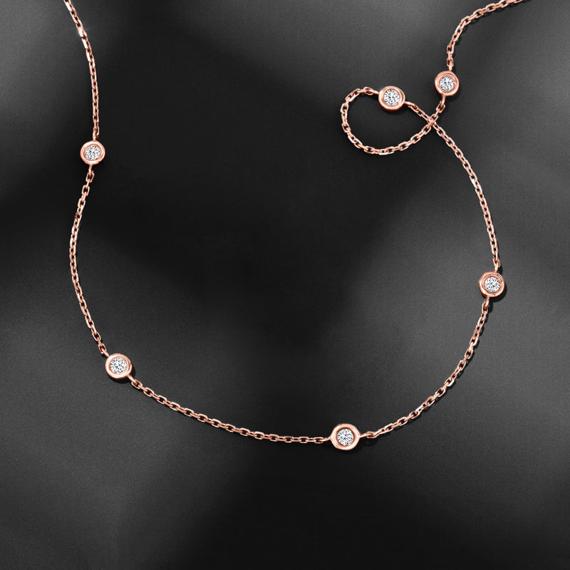 14kt rose gold diamond station necklace with round bezel-set stones on link chain