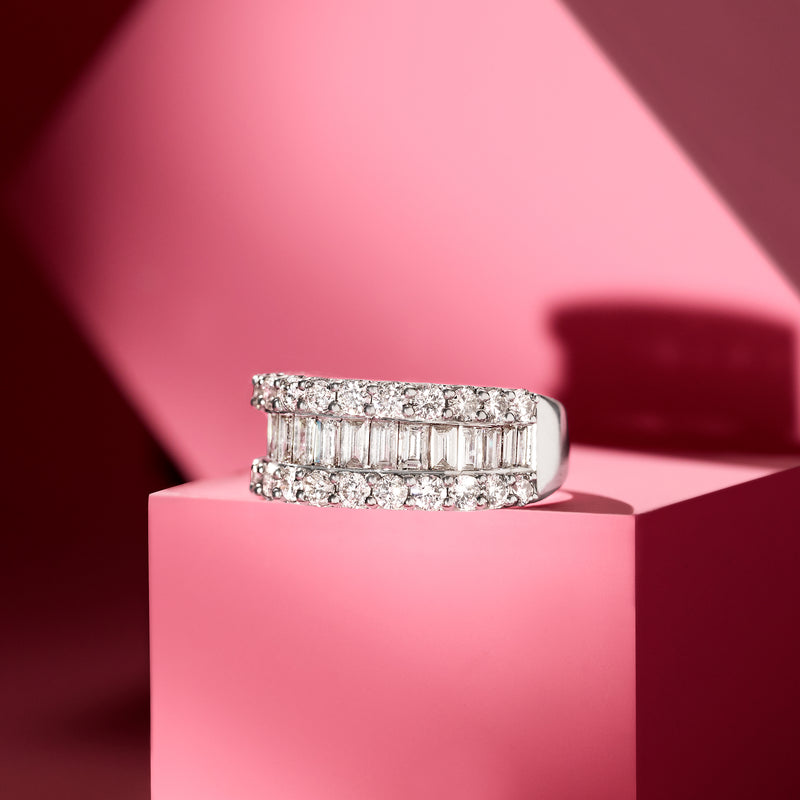 14kt white gold baguette and round diamond ring, top view with raised center