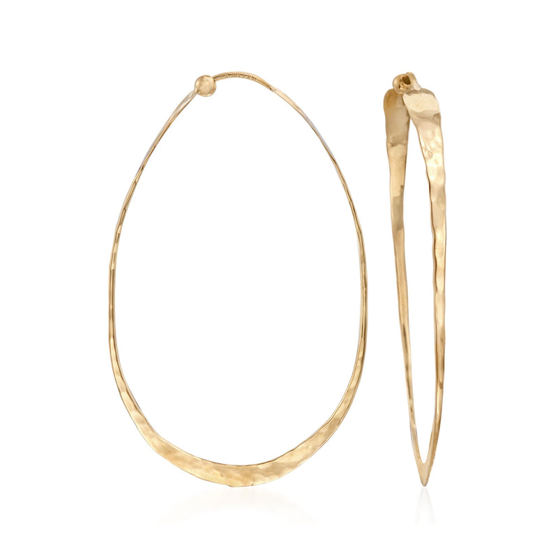 Elongated hammered yellow-gold hoop earrings with oval teardrop profile
