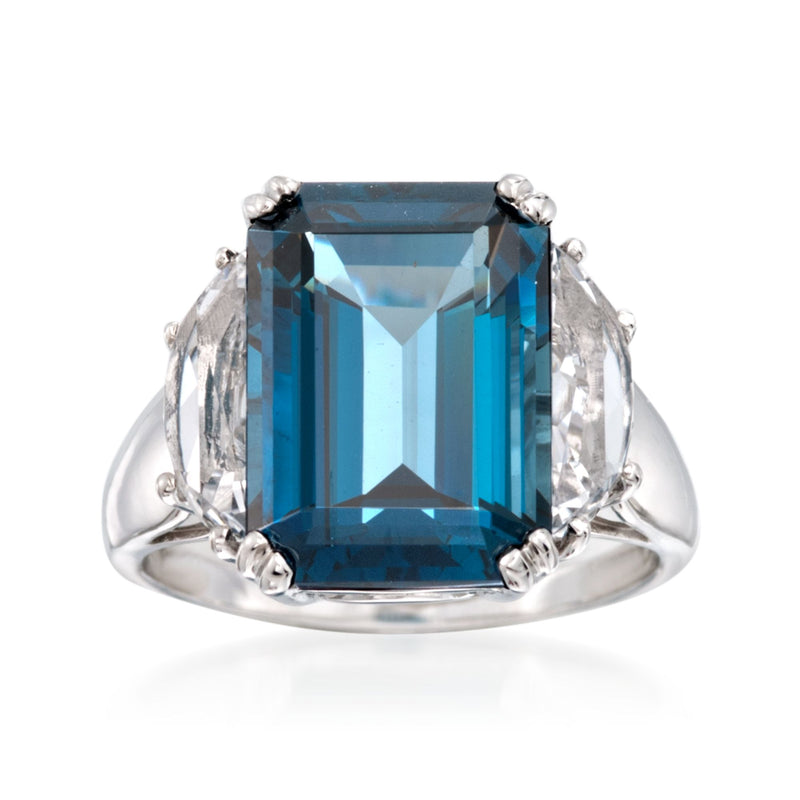 Sterling silver ring with large blue topaz center stone and clear side accents