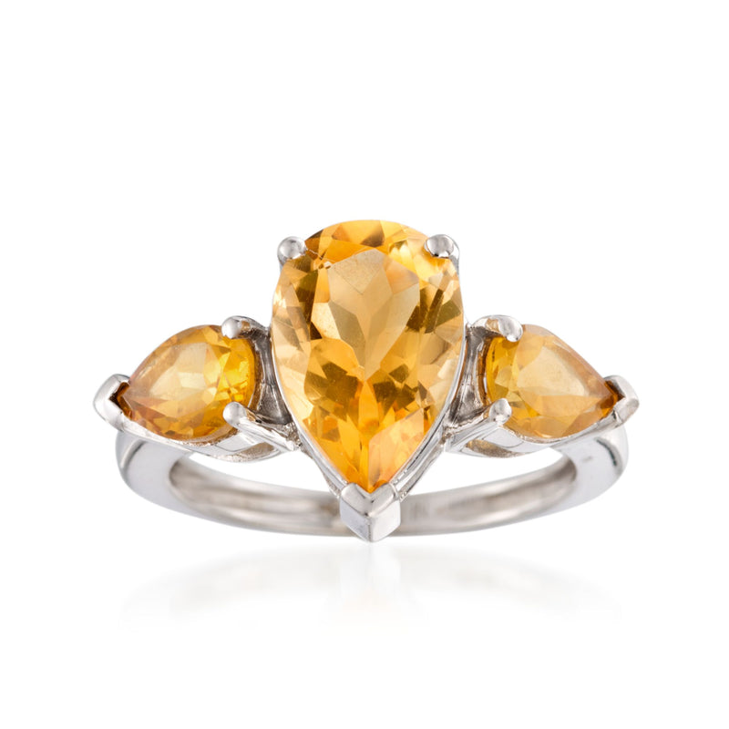 Sterling silver citrine ring with a faceted center stone and two side stones