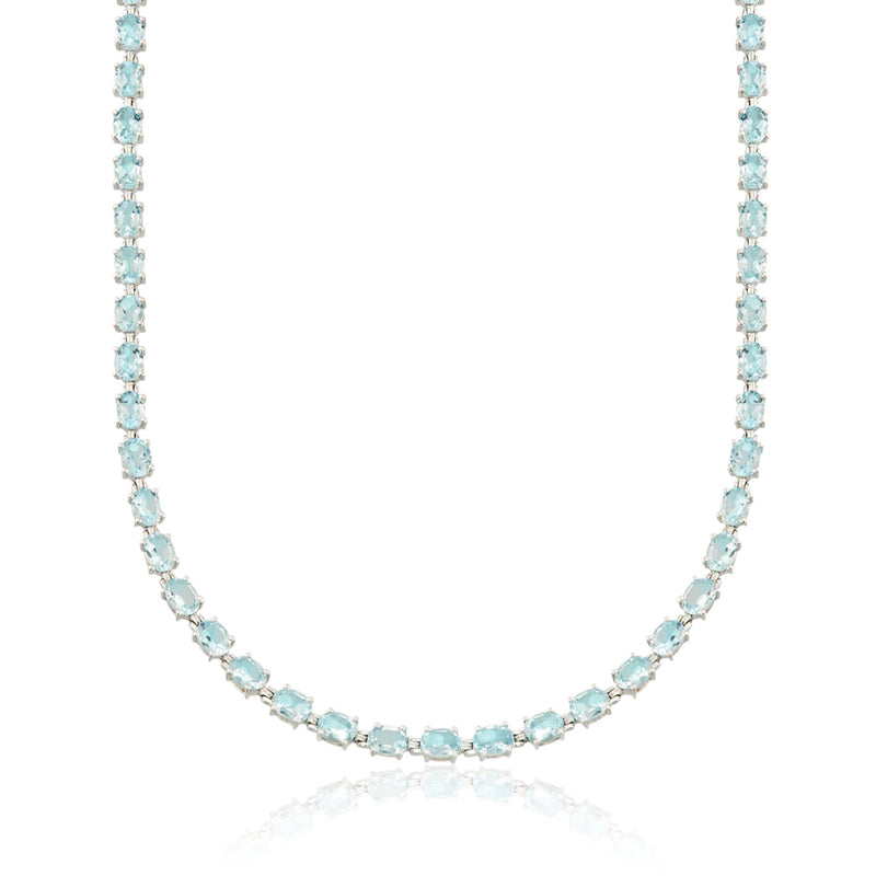 Sterling silver blue topaz tennis necklace with oval blue gemstones in a line