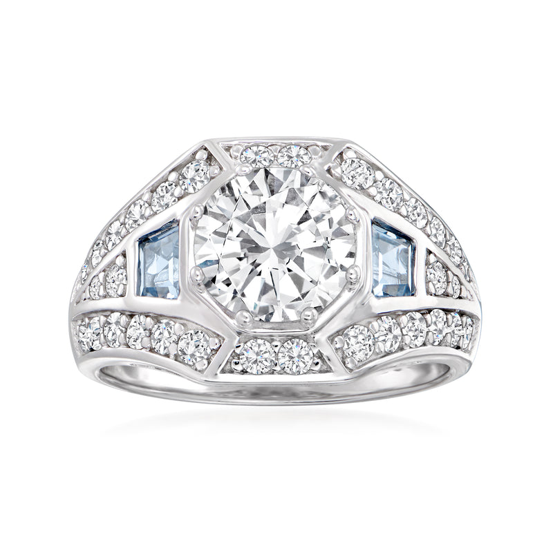 Sterling silver ring with large round clear CZ center and blue simulated aquamarine accents