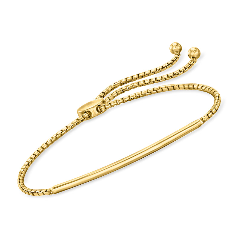 Curved bar bracelet in gold-tone with link chain ends and round clasp.