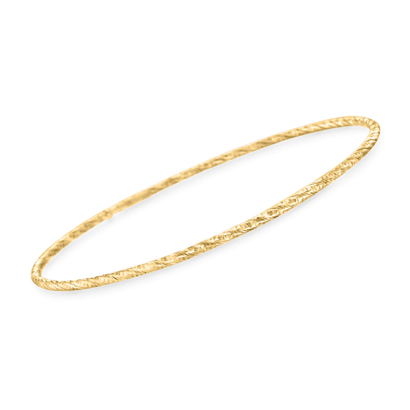 14kt yellow gold textured oval bangle bracelet with polished edges