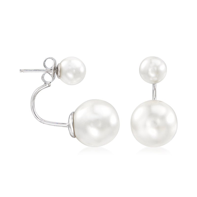 Sterling silver drop earrings with two white round shell pearls on curved hook settings