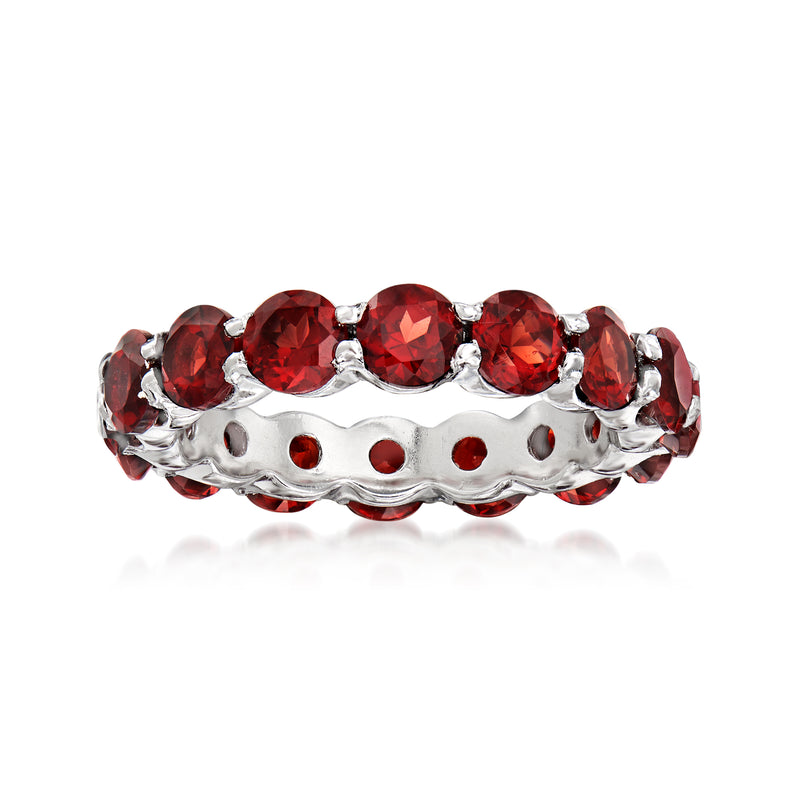 Sterling silver eternity band with red round garnet gemstones in a row