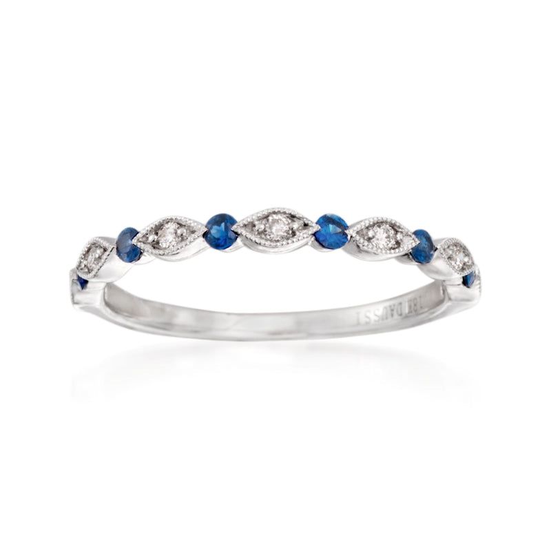 18kt white gold wedding ring with blue sapphire stones and diamond accent wave setting