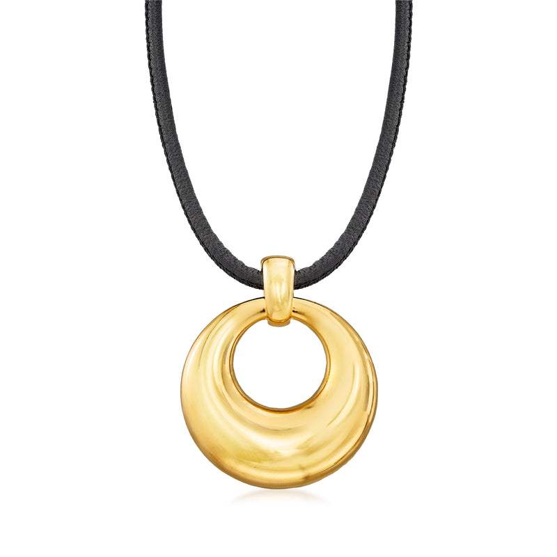 Round gold pendant necklace with black leather cord, gold-tone ring-and-disc design