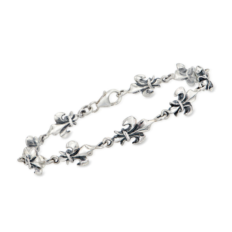 Sterling silver fleur-de-lis link bracelet with dangling floral charms