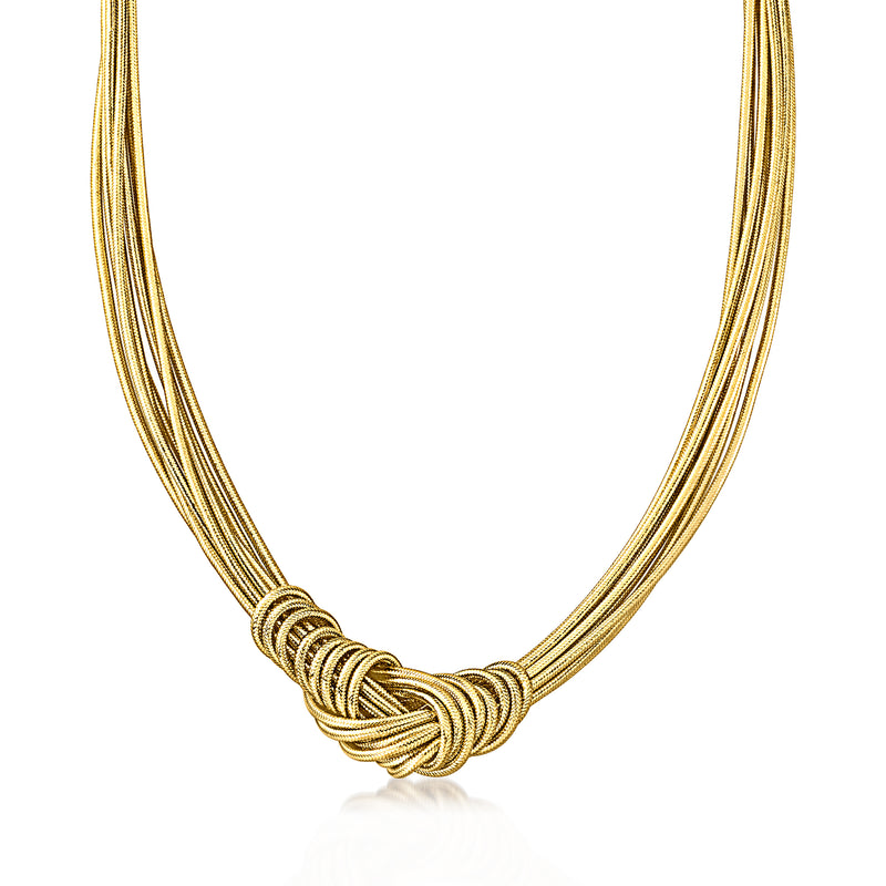 Gold-tone knot necklace with braided cords and coiled knot detail at center