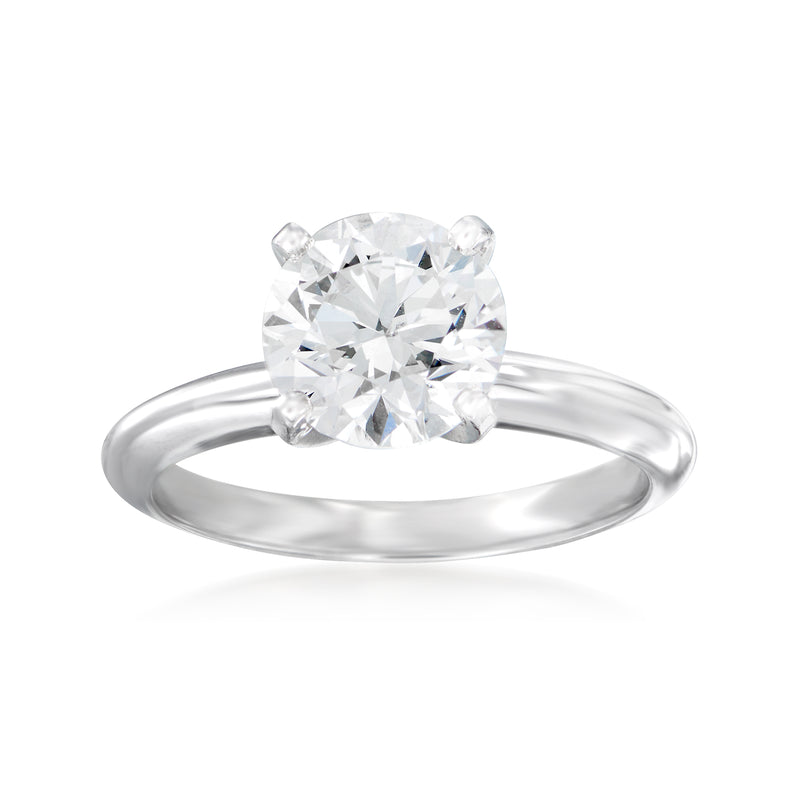 14kt white gold diamond solitaire ring with cushion-cut center stone, polished band