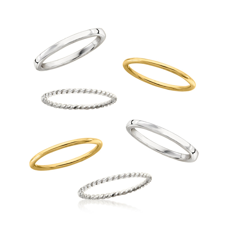 Six stackable rings in silver and gold: flat, braided, and rope-textured bands