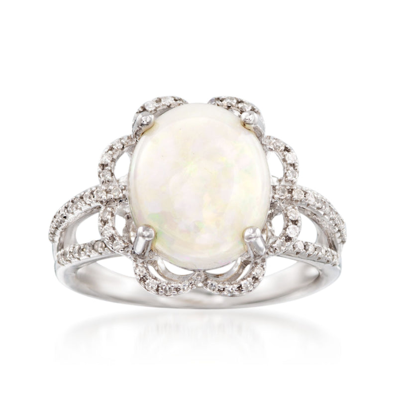 Opal and diamond ring in 14kt white gold with ornate scalloped setting