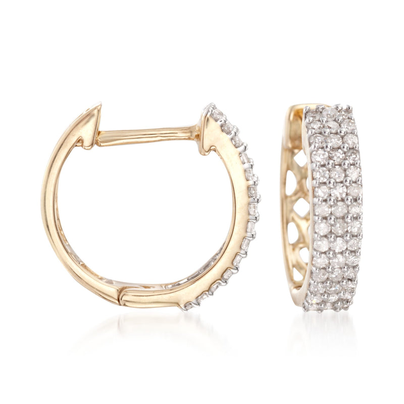 Diamond huggie hoop earrings in 14kt yellow gold, one open and one pavé-set