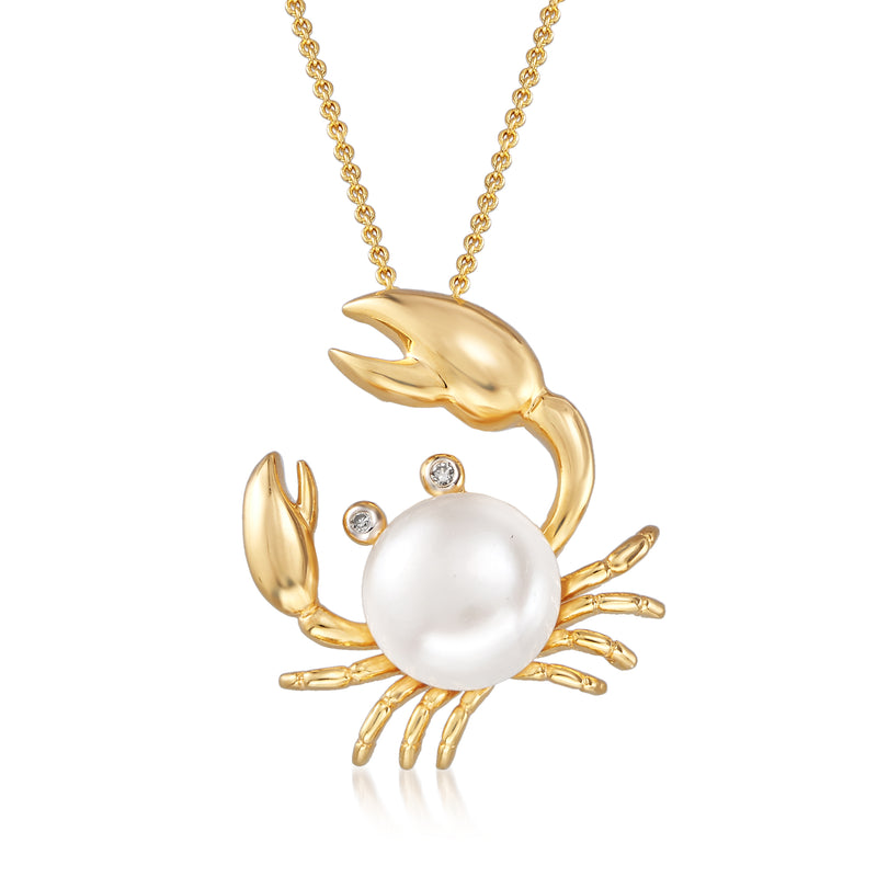 Gold-tone crab pendant necklace with round white pearl and small crystal stones
