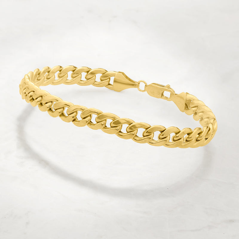 Yellow gold curb-link bracelet angled view with box clasp