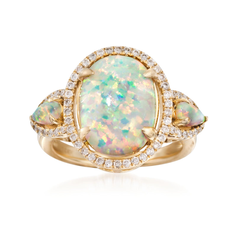 14kt yellow gold opal and diamond ring with oval center stone and side opals