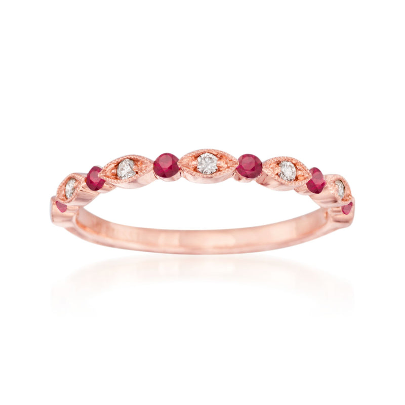 Rose gold wedding ring with red ruby stones and diamond accents, curved band