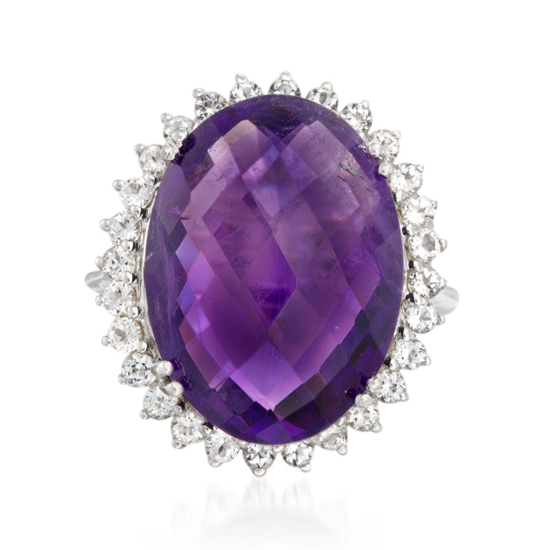 Sterling silver ring with large oval amethyst center and white topaz halo