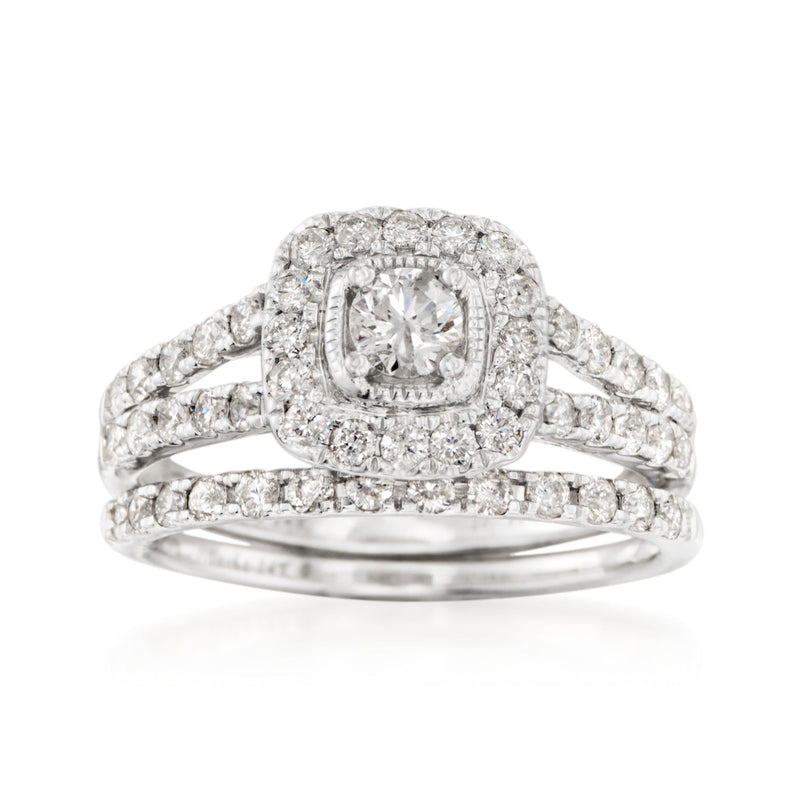 Diamond bridal ring set with oval halo center and round diamond rows in white gold
